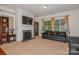 Living room with fireplace, large TV, and comfortable seating at 16718 Dolcetto Way, Charlotte, NC 28277