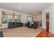 Spacious living room with a view, leather furniture, and dining area at 16718 Dolcetto Way, Charlotte, NC 28277