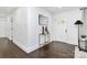 Bright entryway with dark hardwood floors and a stylish console table at 2038 Sandhurst Dr, Charlotte, NC 28205