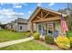 Charming craftsman style home with a welcoming front porch and landscaped yard at 226 Hickory St, Locust, NC 28097