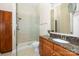 Clean bathroom with shower, granite vanity, and linen closet at 2810 Selwyn Ave # 418, Charlotte, NC 28209