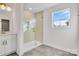 Modern bathroom with a walk-in shower and window at 3050 Swallowtail Ln, Kannapolis, NC 28083