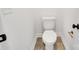 Small half bathroom with toilet and dark tile floor at 3050 Swallowtail Ln, Kannapolis, NC 28083