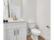 Modern bathroom with white vanity, gold fixtures, and white toilet at 3050 Swallowtail Ln, Kannapolis, NC 28083
