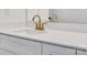 White vanity with gold fixtures and quartz countertop at 3050 Swallowtail Ln, Kannapolis, NC 28083