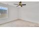 Bright bedroom with ceiling fan and large window at 3050 Swallowtail Ln, Kannapolis, NC 28083