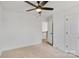 Bedroom with carpet, ceiling fan and access to upper hallway at 3050 Swallowtail Ln, Kannapolis, NC 28083