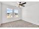 Spacious bedroom with two windows and ceiling fan at 3050 Swallowtail Ln, Kannapolis, NC 28083