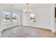 Bright dining room with hardwood floors and large windows at 3050 Swallowtail Ln, Kannapolis, NC 28083