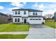 Two-story house with white siding, gray roof, and stone accents at 3050 Swallowtail Ln, Kannapolis, NC 28083