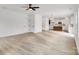 Open living room features hardwood floors, fireplace, and kitchen views at 3050 Swallowtail Ln, Kannapolis, NC 28083