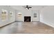 Living room with hardwood floors and a fireplace at 3050 Swallowtail Ln, Kannapolis, NC 28083