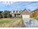 Brick home with two-car garage and landscaped lawn at 3505 Savannah Hills Dr, Matthews, NC 28105