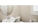 Small half bathroom with white sink and toilet at 3589 County Down Ave, Kannapolis, NC 28081