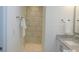 Walk-in shower with marble-look tile and built-in shelves at 415 Newstyle Way # 6, Cramerton, NC 28056