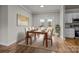 Bright dining area with hardwood floors and access to the backyard at 4759 Mel Nunnery Rd, Fort Lawn, SC 29714