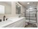 Elegant bathroom with a double vanity, quartz countertop and frameless glass shower at 626 Smith St, Kannapolis, NC 28083