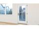 White door with glass panel leading to backyard patio at 7022 Impulse Ct, Charlotte, NC 28205