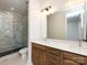 Double vanity bathroom with marble shower at 7022 Impulse Ct, Charlotte, NC 28205