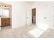 Spacious bedroom with an attached bathroom and ample sunlight at 7022 Impulse Ct, Charlotte, NC 28205