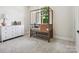 Bright Bedroom with crib, dresser, and large window at 7022 Impulse Ct, Charlotte, NC 28205
