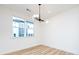 Bright dining room with large window and modern chandelier at 7022 Impulse Ct, Charlotte, NC 28205
