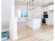 Open concept kitchen with island and stainless steel appliances at 7022 Impulse Ct, Charlotte, NC 28205
