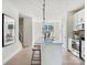 Modern kitchen with white cabinets and a large island at 7022 Impulse Ct, Charlotte, NC 28205