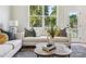Comfortable living room with neutral colored couch and coffee table at 7022 Impulse Ct, Charlotte, NC 28205
