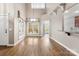 Sunlit dining area with hardwood floors and an open view to the kitchen at 7708 Spanish Oaks Dr, Waxhaw, NC 28173