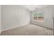 Bright dining area with carpeted floors and a chandelier at 7937 Rusty Plow Ct, Charlotte, NC 28216