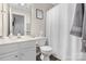 Clean bathroom with white vanity, toilet and shower/tub at 7947 Marie Roget Way, Charlotte, NC 28277