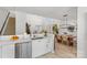 Open kitchen with island and view to dining area at 7947 Marie Roget Way, Charlotte, NC 28277