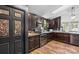 Modern kitchen with dark wood cabinets and granite countertops at 10375 Cool Springs Rd, Woodleaf, NC 27054