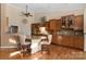 Eat-in kitchen with island seating and hardwood floors at 1108 Butterburr Dr, Matthews, NC 28104