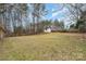 Large backyard with a shed and wooded area at 124 Redwood Ln, Gastonia, NC 28052