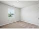 Well-lit bedroom with neutral carpet and window blinds at 1538 Doran Ter, Richburg, SC 29729