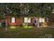 Brick ranch house with a well-maintained lawn at 1737 Edgewater Dr, Charlotte, NC 28210