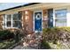 Inviting front porch with blue door and brick steps at 1737 Edgewater Dr, Charlotte, NC 28210