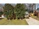 Brick ranch house with carport and landscaping at 1737 Edgewater Dr, Charlotte, NC 28210