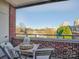 Brick balcony with small table and chairs, offering city views at 224 N Poplar St # 19, Charlotte, NC 28202