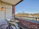 Relaxing balcony with table and chairs overlooking trees and buildings at 224 N Poplar St # 19, Charlotte, NC 28202