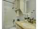 Bathroom with granite countertop, subway tile shower, and linen cabinet at 224 N Poplar St # 19, Charlotte, NC 28202