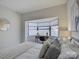Bright bedroom with bay window and comfortable bedding at 224 N Poplar St # 19, Charlotte, NC 28202