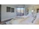 Bedroom with queen-size bed, balcony access, and mirrored closet at 224 N Poplar St # 19, Charlotte, NC 28202