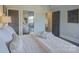 Bedroom with a queen-size bed and access to a private balcony at 224 N Poplar St # 19, Charlotte, NC 28202