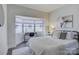 Bedroom with bay window, desk, and queen-size bed at 224 N Poplar St # 19, Charlotte, NC 28202