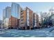 Modern brick building exterior on a corner lot with street parking at 224 N Poplar St # 19, Charlotte, NC 28202