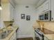Modern kitchen with granite counters, stainless steel appliances, and white cabinets at 224 N Poplar St # 19, Charlotte, NC 28202