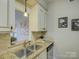 Modern kitchen with granite countertops and stainless steel appliances at 224 N Poplar St # 19, Charlotte, NC 28202